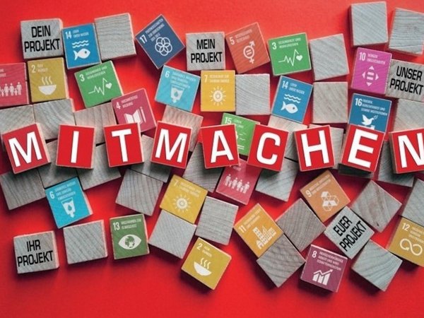Einzelne Buchstaben bilden das Wort "Mitmachen" 